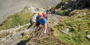 Climbers at Via Ferrata Xtreme at Honister Slate Mine in Borrowdale, Lake District