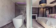 Bedroom with tub at Abbey House Hotel & Gardens in Barrow-in-Furness, Cumbria