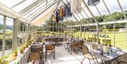 Seating and Decor inside the Victorian Glasshouse at Another Place, The Lake, Ullswater in Watermillock, Lake District