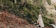 Bride Posing for Photos on the Grounds at a Wedding at Allan Bank in Grasmere, Lake District