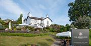Signage and garden seating at The Angel Inn in Bowness-on-Windermere, Lake District