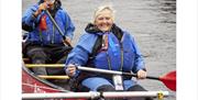 Visitors Canoeing with Anyone Can in the Lake District, Cumbria