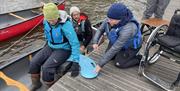 Visitors Canoeing with Anyone Can in the Lake District, Cumbria