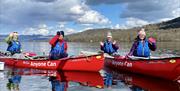 Visitors Canoeing with Anyone Can in the Lake District, Cumbria