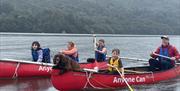 Visitors Canoeing with Anyone Can in the Lake District, Cumbria