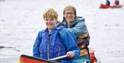 Visitors Canoeing with Anyone Can in the Lake District, Cumbria