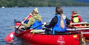 Visitors Canoeing with Anyone Can in the Lake District, Cumbria