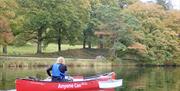 Visitors Canoeing with Anyone Can in the Lake District, Cumbria