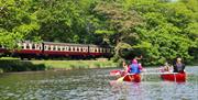 Visitors Canoeing with Anyone Can in the Lake District, Cumbria