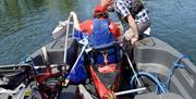 Visitors Canoeing with Anyone Can in the Lake District, Cumbria