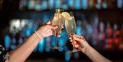 Visitors Toasting Drinks at Lake View Restaurant, Armathwaite Hall Hotel and Spa in Bassenthwaite, Lake District