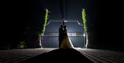 Happy Couple Posing for Wedding Photos at Armathwaite Hall Hotel and Spa in Bassenthwaite, Lake District