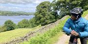 Visitor Riding a Mountain Bike from Arragon's Cycle Hire at Lowther Castle in Penrith, Cumbria