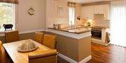 Kitchen dining area in a three-bed apartment