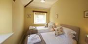 Twin Bedroom at Autumn Cottage at Helm Mount Cottages in Barrows Green, Cumbria