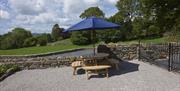 Picnic Table and Outdoor Space at Autumn Cottage at Helm Mount Cottages in Barrows Green, Cumbria