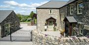 Exterior and Entrance to Autumn Cottage at Helm Mount Cottages in Barrows Green, Cumbria