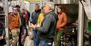 Visitors on a Brewery Tour at Bowness Bay Brewing in Kendal, Cumbria