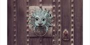 Historic Door Knocker at Black Cat Distillery at Brougham Castle near Penrith, Cumbria