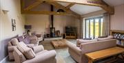 Lounge and wood burner at Low Ploughlands Holiday Lets in Little Musgrave, Cumbria