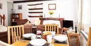 Dining and living space at Birchbank Cottage in the Lake District, Cumbria
