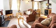 Dining and living space at Birchbank Cottage in the Lake District, Cumbria