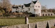 Bridal Couple Standing Outside at Blackwell – the Arts and Crafts house in Bowness-on-Windermere, Lake District