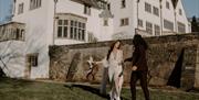 Bridal Couple Walking the Grounds at Blackwell – the Arts and Crafts house in Bowness-on-Windermere, Lake District