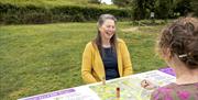 Board game in the orchard at Hill Top in Near Sawrey, Ambleside, Lake District