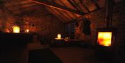 Cosy nighttime interior of The Bothy, Troutbeck