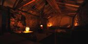 Cosy nighttime interior of The Bothy, Troutbeck