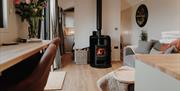 Living area and wood burner at Brackenslack Shepherds Huts in Maulds Meaburn, Cumbria