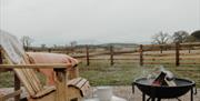 Outdoor seating and firepit at Brackenslack Shepherds Huts in Maulds Meaburn, Cumbria