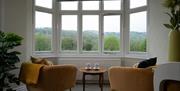 Seating with scenic view from bay window at Brantholme B&B in Ambleside, Lake District