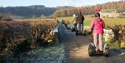 Visitors enjoying an experience with Lakeland Segway in Cartmel, Lake District