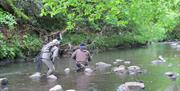 Visitors river fishing with West Pennine Angling Solutions in the Lake District, Cumbria