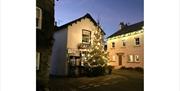 Festive Decorations at Cartmel Village Shop in Cartmel, Cumbria