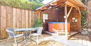 Outdoor Seating and Hot Tub at The Bridge Cottages in Coniston, Lake District