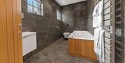 Bathroom with Tub at Springbank Cottage in Coniston, Lake District
