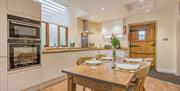 Dining Area and Kitchen in The Cottage at The Yan in Grasmere, Lake District