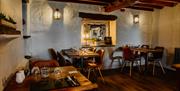 Dining Tables and Seating at The Restaurant at Crooklands Hotel in Milnthorpe, Cumbria