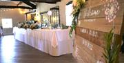 Head Table and Welcome Sign for a Wedding at Crooklands Hotel in Milnthorpe, Cumbria