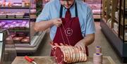 Butcher at Cranstons Cumbrian Food Hall in Penrith, Cumbria
