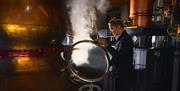 Employee Working at the Stills at The Lakes Distillery near Cockermouth, Lake District