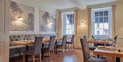 Dining room seating at The Wilding Hotel in Brough, Cumbria