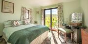 Double Bedroom with Dressing Table and Outdoor Access at High Greenside Bed and Breakfast in Ravenstonedale, Cumbria