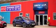 Car and Entrance at Drivalia Car Hire Carlisle