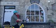 Visitor Cycling on an E-Bike from Ease E Ride in Beetham, Cumbria