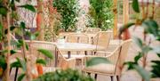Wicker outdoor seating at The Wilding Hotel in Brough, Cumbria