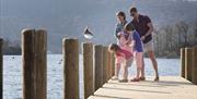 Family on a Pier at Fallbarrow Holiday Park in Bowness-on-Windermere, Lake District
